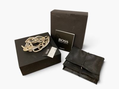 the box is open and has a bracelet in it