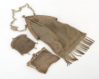 an image of a brown purse with a chain around it and a chain around it