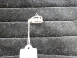 a white tag hanging from a string on a black background