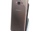 samsung galaxy s8 and s9 are shown side by side on a white surface