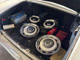 a trunk of a car with a bunch of speakers in it