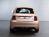 a car that is parked in a room with a white wall