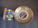 a small cup and saucer sitting on a table
