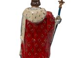 a figurine of a king with a crown and a sword