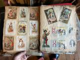 a person holding an open book with pictures on it