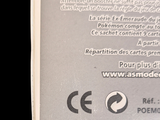 a close up of a package of toothpaste on a black background