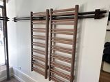 a picture of a room with a wooden ladder on the wall