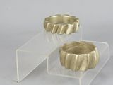 pair of gold plated candle holders on clear acrylic stands