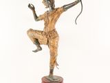 bronze statue of a man holding a bow and arrow on a wooden base