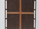 an image of a metal and wood folding chair with a cross on the back