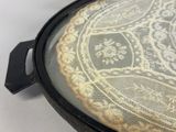 a close up of a lace covered tray on a table