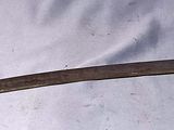 a knife that is laying on a white sheet
