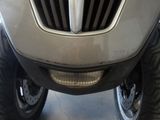 a close up of the front end of a silver truck