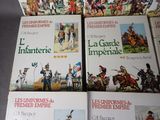 four books on a table with pictures of soldiers and soldiers on them