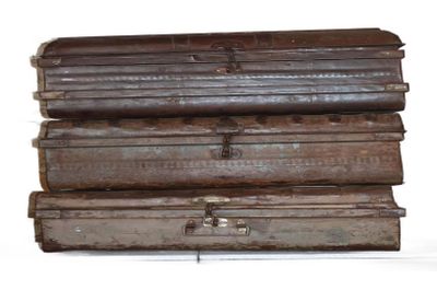 several pieces of luggage stacked on top of each other on a white surface