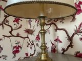 a lamp that is sitting on a table in front of a wallpaper