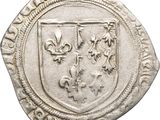 a close up of a coin with a coat of arms on it