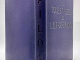an old purple book with the title of a book on it