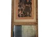 a picture of a picture hanging on a wall above a mirror