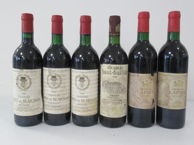 six bottles of wine are lined up in a row on a table