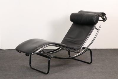 black leather chaise lounger with black leather seat and foot rest