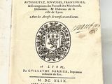 a book with a picture of a coat of arms on it