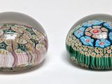 two eggs that have been decorated with flowers on them