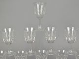 a lot of wine glasses sitting on a table
