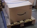 a box on a pallet with a smile drawn on it