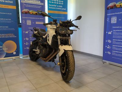 a motorcycle that is parked in a showroom
