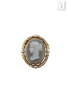 a close up of a ring with a picture of a woman on it