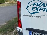 a white van that is parked on the side of the road