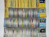 a lot of pokemon cards on the table together