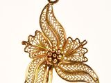 gold plated flower pendant with filigree filigree leaves