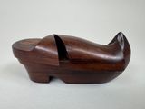 wooden shoe shaped like a cat with a hole in it