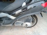 a scooter that is parked in a garage