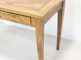 a small wooden table with a drawer on it
