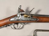 a gun that is on display on a table