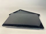 a laptop computer sitting on top of a white table