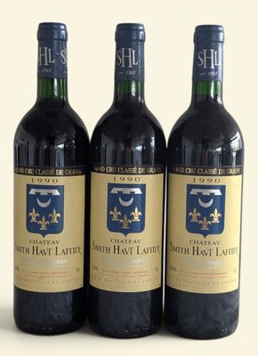 three bottles of wine sitting on top of a table next to each other