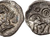 a close up of a coin with a bird on it