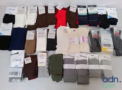 several pairs of men ' s socks are laid out on a table