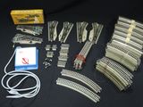 a lot of train tracks and wires on the table
