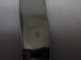 a close up of a silver spoon on a table
