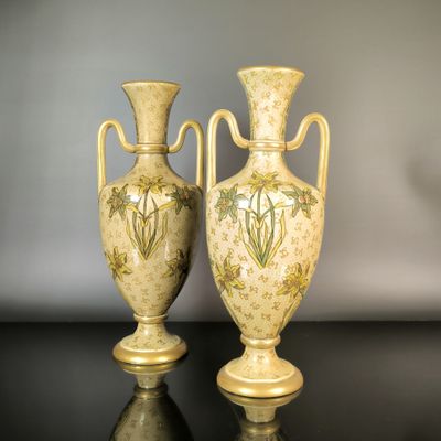 two vases that are sitting on a table