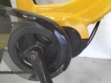 a yellow scooter with a black handlebar attached to it