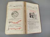 an open book with a drawing of a man on it