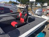 a red and black seat in the back of a boat
