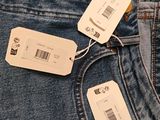 two tags on the back of a pair of jeans