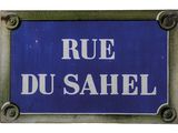 a blue sign that says rue du sahel on it